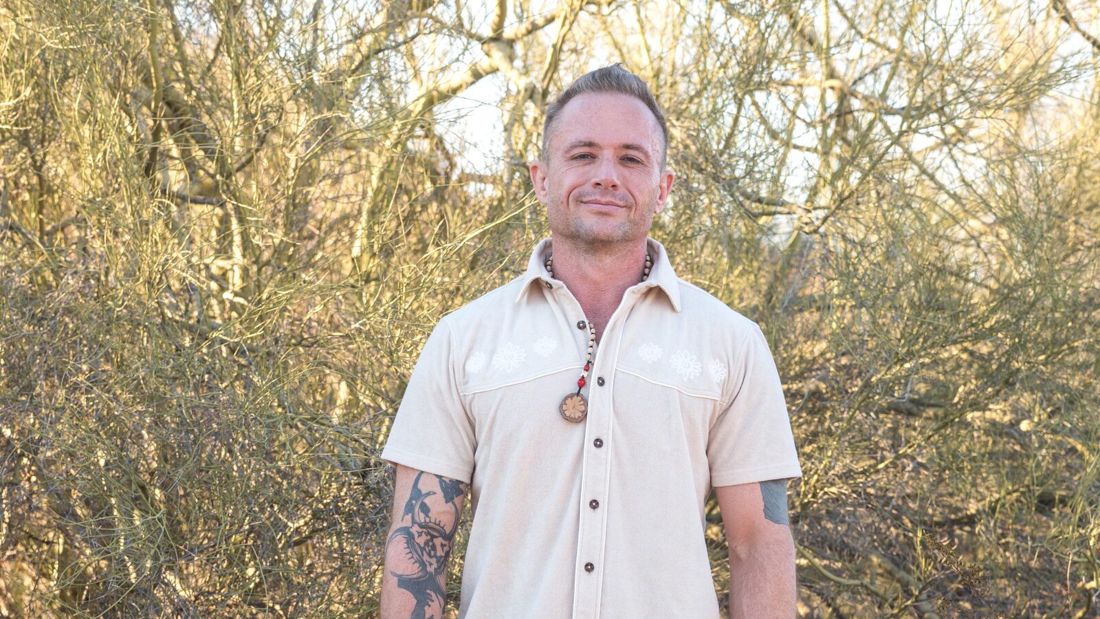 Spencer Thornock standing outdoors in a light shirt.